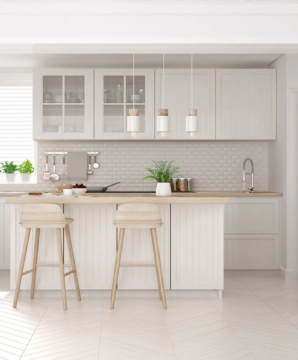 Bright white kitchen remodeling in Cupertino, CA featuring a light wood island, wooden bar stools, white subway tile backsplash, and glass-front upper cabinets.