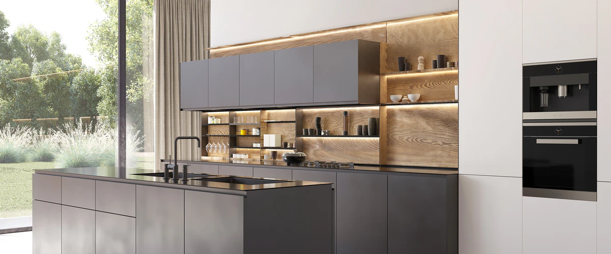 Modern minimalist kitchen showcasing sleek dark gray flat-panel cabinets, built-in appliances, and warm illuminated wood open shelving next to a large window.