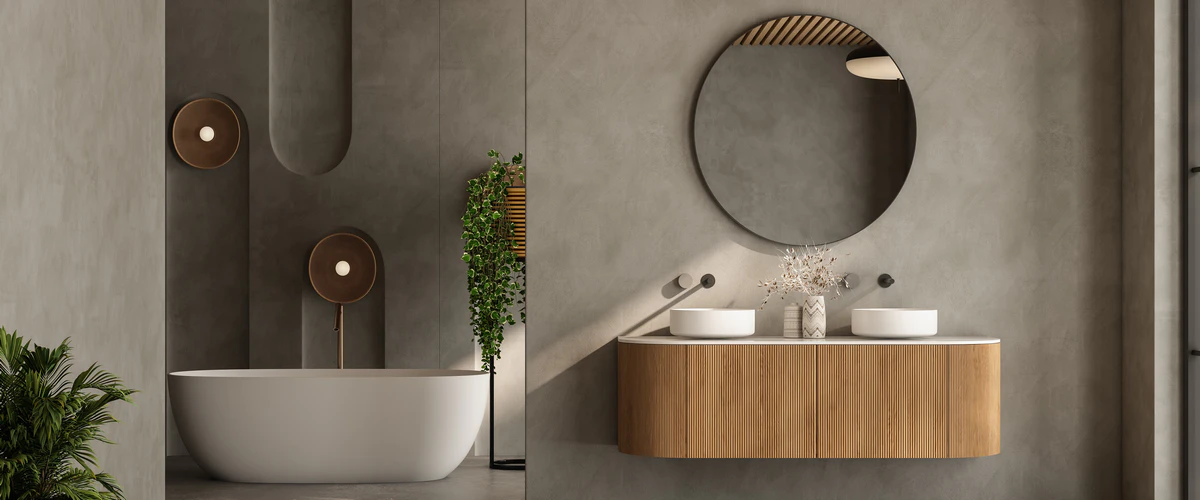 Stylish modern gray bathroom design showcasing architectural wall arches, warm circular sconce lighting, a slatted wood vanity with two sinks, and a sleek freestanding tub.