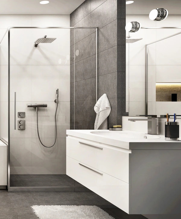 Modern bathroom remodeling in Cupertino, CA featuring a sleek white floating vanity, a glass-enclosed shower with gray accent tiles, and polished chrome fixtures.